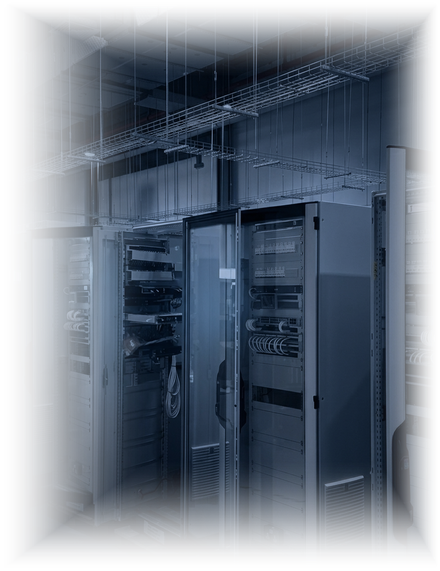 Control panel assembly room at the Integration Center: rows of open steel cabinets being wired and racked beneath overhead cable trays